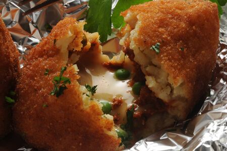 Open arancina, showing the rice and rag? stuffingの写真素材