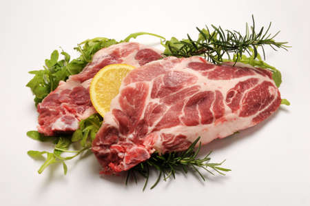 Pork chops with herbs and lemonの写真素材