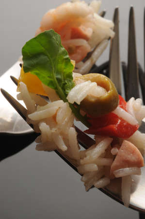 Closeup on rice salad in the forksの写真素材