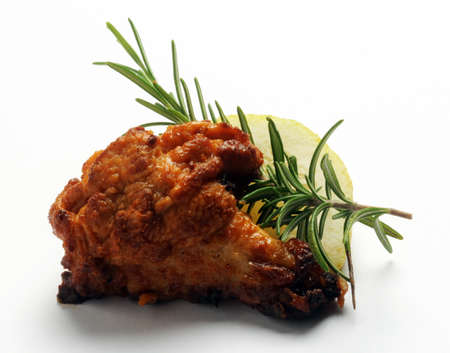 Chicken leg with rosemary and lemonの写真素材