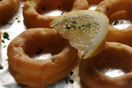 Close up on baked calamari ringsの写真素材