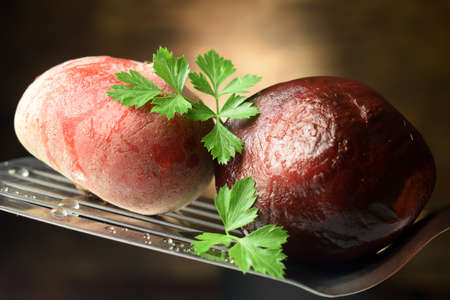 Close up on uncooked and precooked beetrootの写真素材