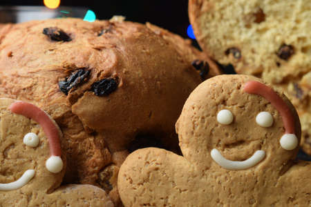 Close up on panettone and gingerbread men.