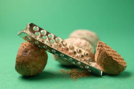 Closeup of nutmegs with graterの写真素材