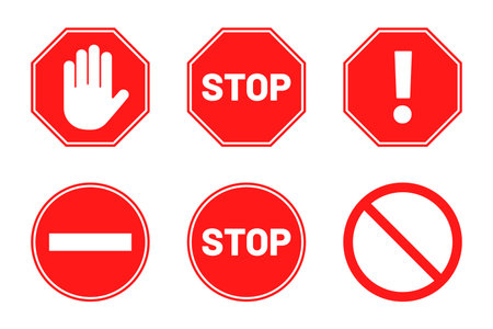 Stop signs collection. Red stop signs in octagon and round shape. Traffic warning and prohibiting icons with hand, text and exclamation mark. Vectorのイラスト素材