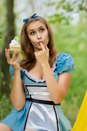 Portrait of beautiful brown-haired girl in a suit of Alice in Wonderlandのeditorial素材