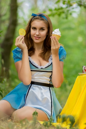 Portrait of beautiful brown-haired girl in a suit of Alice in Wonderlandのeditorial素材