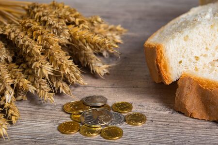 Kazakhstan tenge on the table with wheat ears and bread. Bread in Kazakhstan and Kazakhstan wheat.
