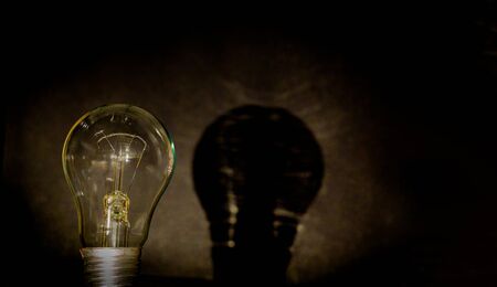 Light bulb, business idea concept. A light bulb on a black background to place text or illustration....