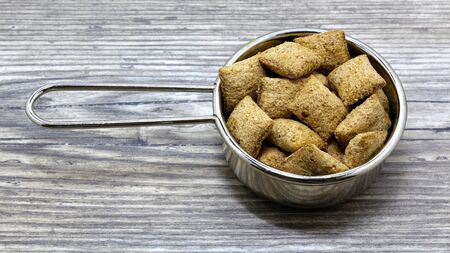 crackers on a plate on a wooden backgroundの写真素材
