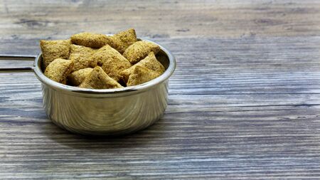 crackers on a plate on a wooden background