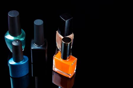 gel Polish for manicure on a white black background isolated, with space. Scattered nail Polish in the beauty salon. The choice of color nail Polish for manicure or pedicure.の写真素材