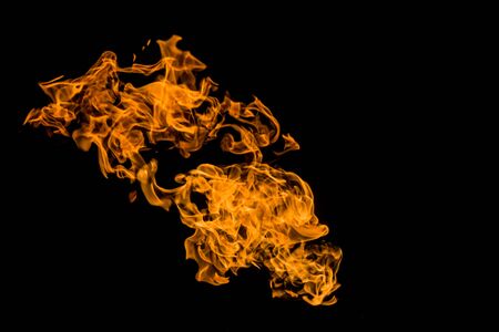 Burning flame or fire isolated on black background. Fire flames on black background. fire on black background isolated. fire patterns.の写真素材