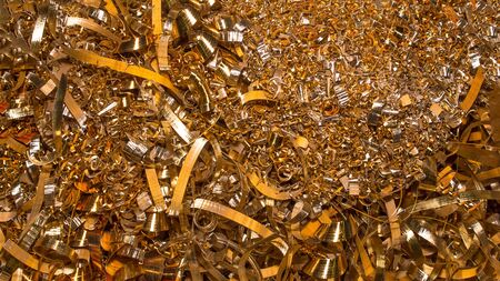 Golden background. Abstract gold background of metal shavings. Wallpaper or screensaver of yellow...