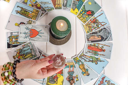 Bangkok,Thailand,March.15.20. A fortune teller holds a magic ball.On the table are fortune-telling...