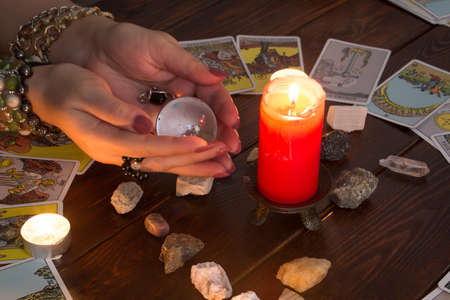 Bangkok,Thailand,March.15.20. A fortune teller holds a magic ball.On the table are fortune-telling...