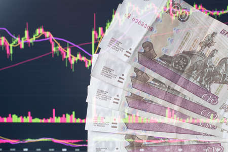 Russian rubles against the background of the exchange's trading schedule. Trading stocks, bonds, and...