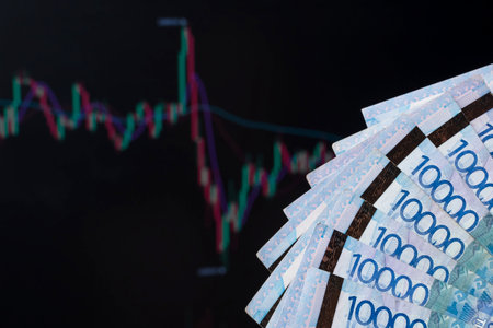 Kazakhstan banks and loans in tenge. Tenge in Kazakhstan against the background of a laptop with an...