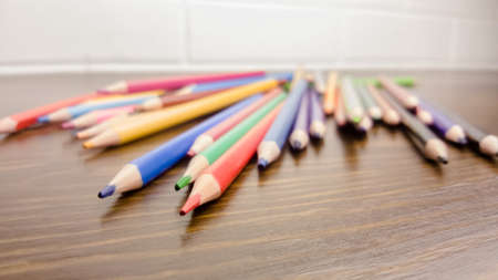 A set of colored pencils, stationery. A lot of multicolored pencils on the table.の写真素材
