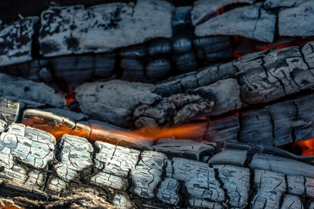 A blazing fire in the dark. Ignition of wood in the fire. A bright burning flame. Sparks and flames...