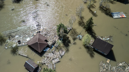 Floods and cyclones, global warming. Climate change, natural disasters the tsunami of nature. The apocalypse, catastrophes. Storms and destruction. The remnants of human life are floating in dirty waterの写真素材