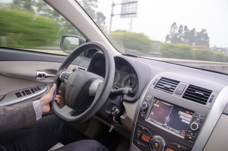 Close-up driving posture.drive a car catch steering wheel.のeditorial素材