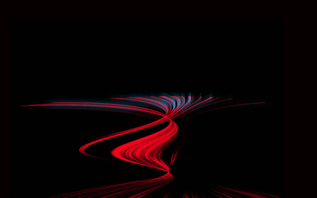 Moving cars with fast blurred trail of headlightsの写真素材