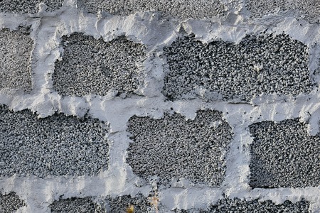 the gray texture of the masonry