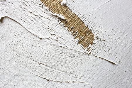 wash of white primer of the canvas. texture for artistsの写真素材