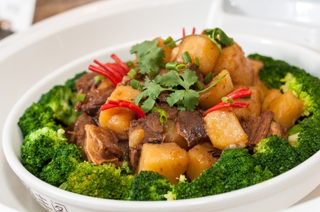 Roast mutton with potatoes and broccoliの写真素材