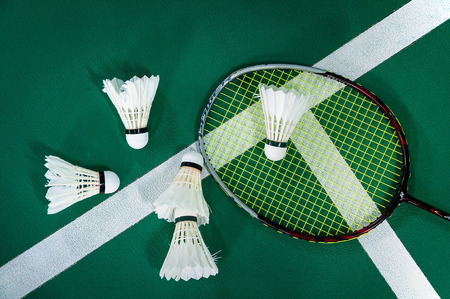 shuttlecocks and badminton racket.