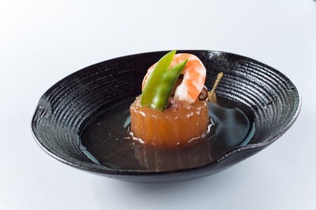 Foie gras, shrimp, mushrooms, peas in the black plate,kaisekiの写真素材