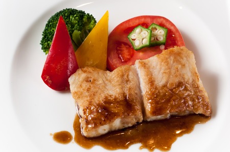 Fried fish with onion sauceの写真素材