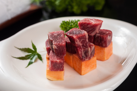 Raw beef grain on the plateの写真素材