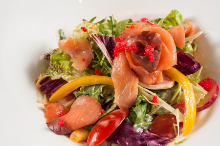 vegetable salad with smoked salmonの写真素材
