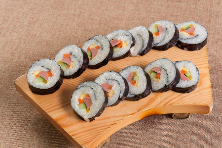 Sushi in a wooden dishの写真素材