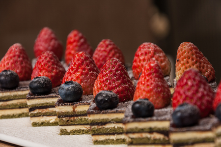 Tiramisu with strawberry and blueberryの写真素材