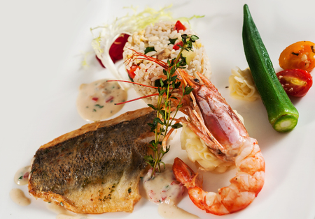 Pan fry sea bass filet and red king prawn with riceの写真素材