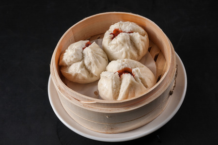 Steamed bun stuffed with barbecued roast pork; cha siu souの写真素材