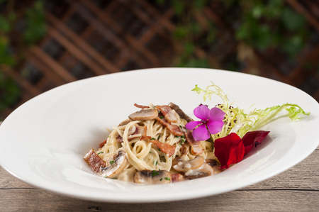 Italian spaghetti with mushrooms and baconの写真素材