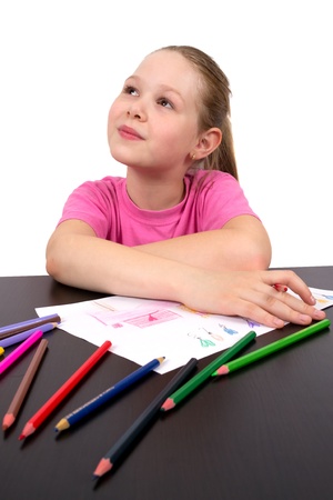 The girl draws a picture color pencilsの写真素材