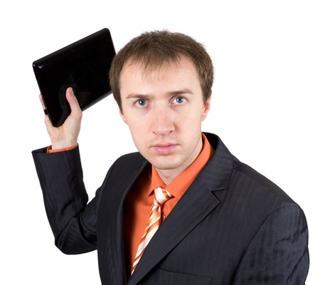 The young businessman throws out laptopの写真素材