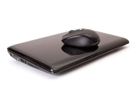 Laptop and mouse on whiteの写真素材