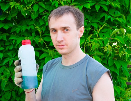 The man with a lubricating oil bottleの写真素材