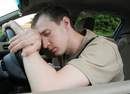 man sleep in a carの写真素材