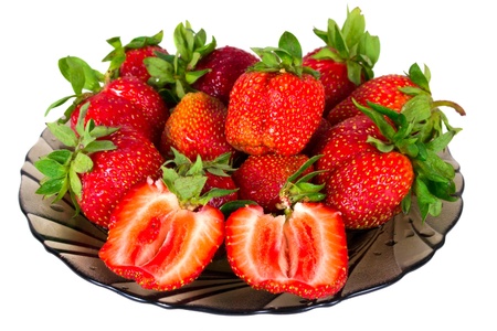 Strawberry berries on plate isolated on whiteの写真素材