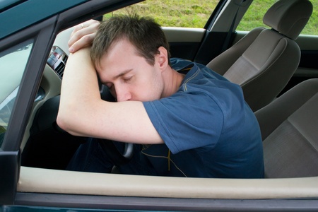 The man sleeps in the carの写真素材
