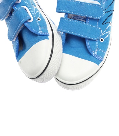 Blue sneakers isolated on white backgroundの写真素材