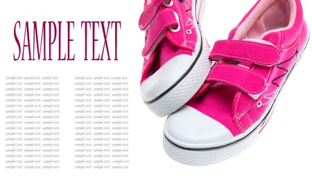  Pink sneakers isolated on white background with sample text の写真素材