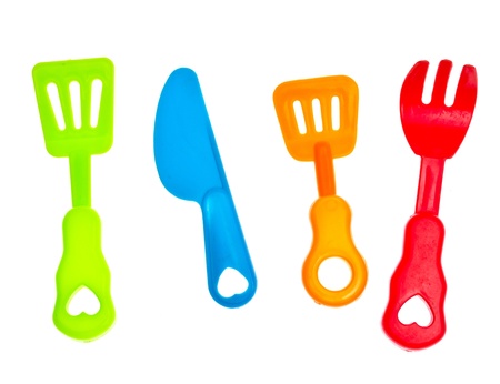 Plastic  knife and fork, against a white backgroundの写真素材